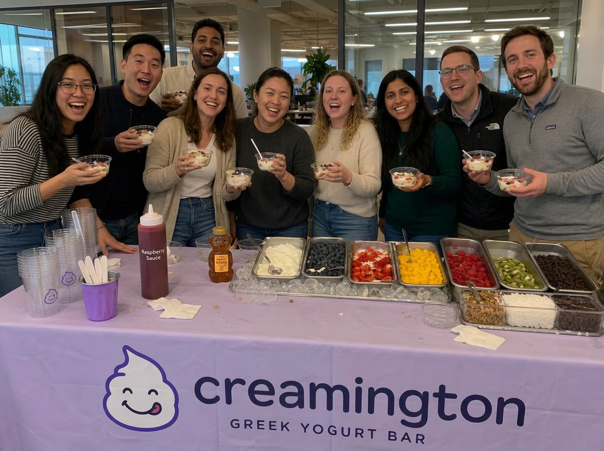 Office team smiling in front of the Creamington yogurt bar
